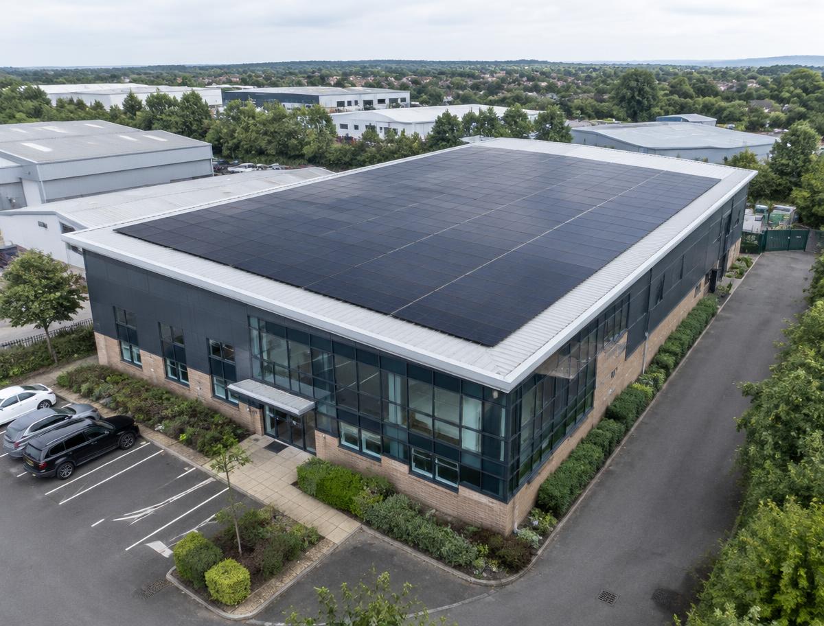 Commercial building with a large rooftop solar panel installation